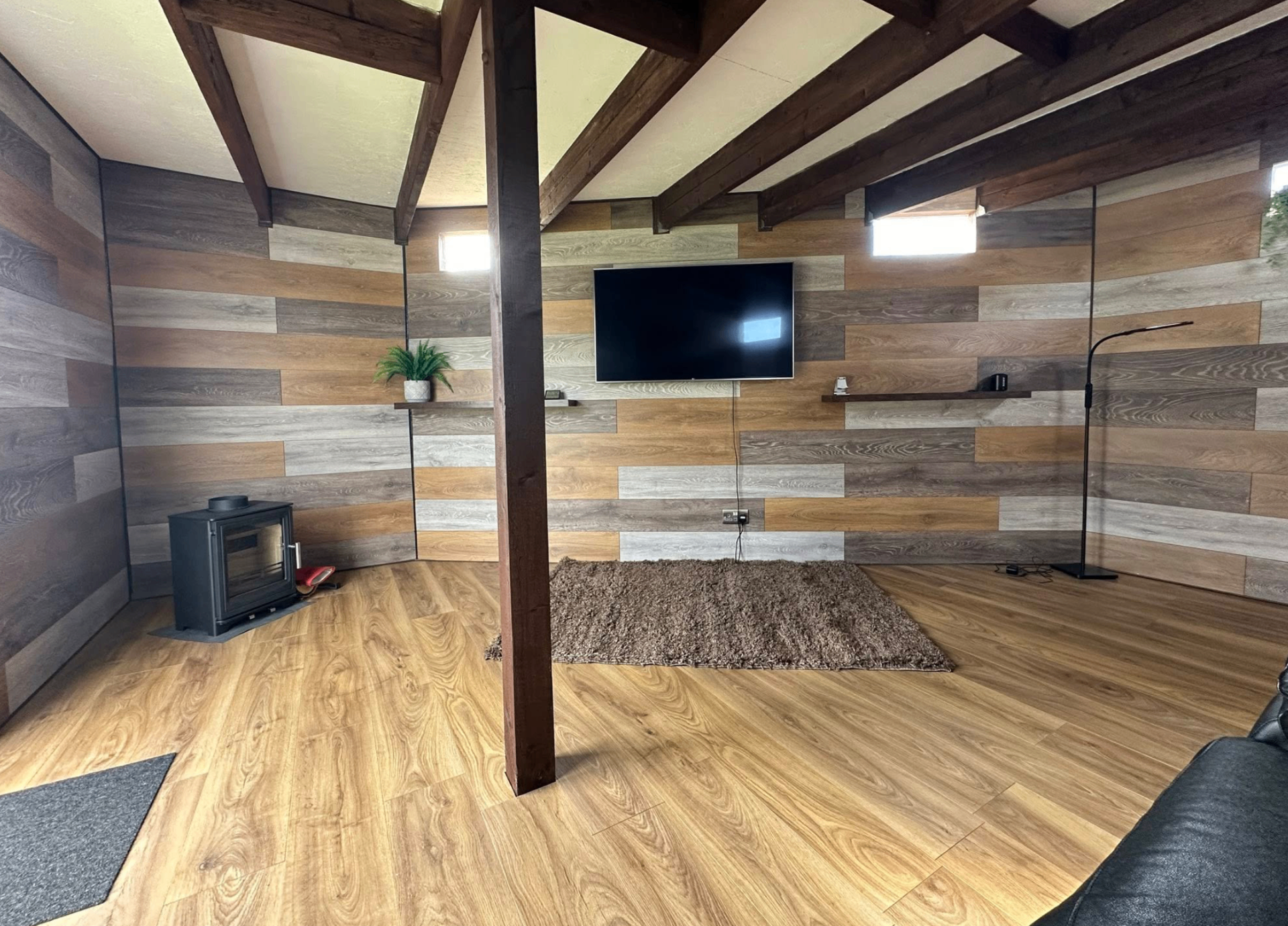 Finished summer house interior with log burner